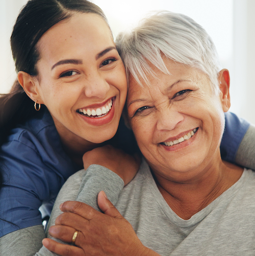 Smiling patient and their cancer provider
