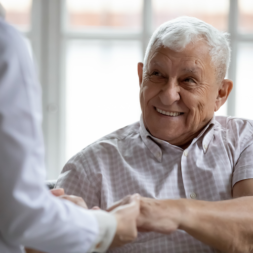 Thermal ablation patient smiling holding hand of physician