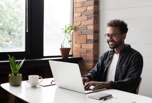 Hispanic male working at computer