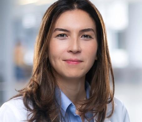 Dr. Haran in her white coat